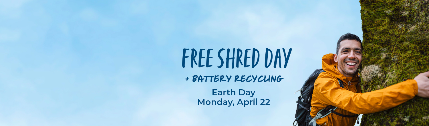 Man hugging a tree with text that reads Free Shred Day + Battery Recycling Earth Day Monday April 22